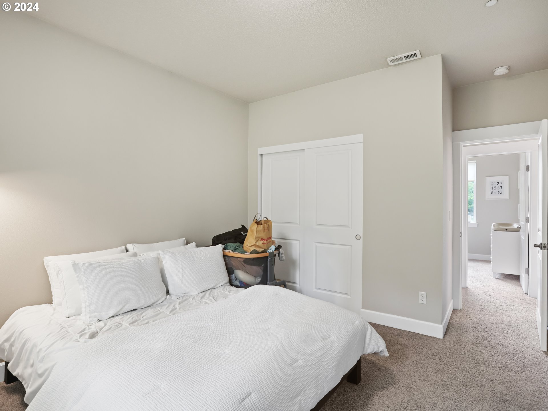 8087 Southwest Oldham Drive Beaverton, OR 97007 - Photo 34 of 46 a bedroom with a bed and a view of bathroom
