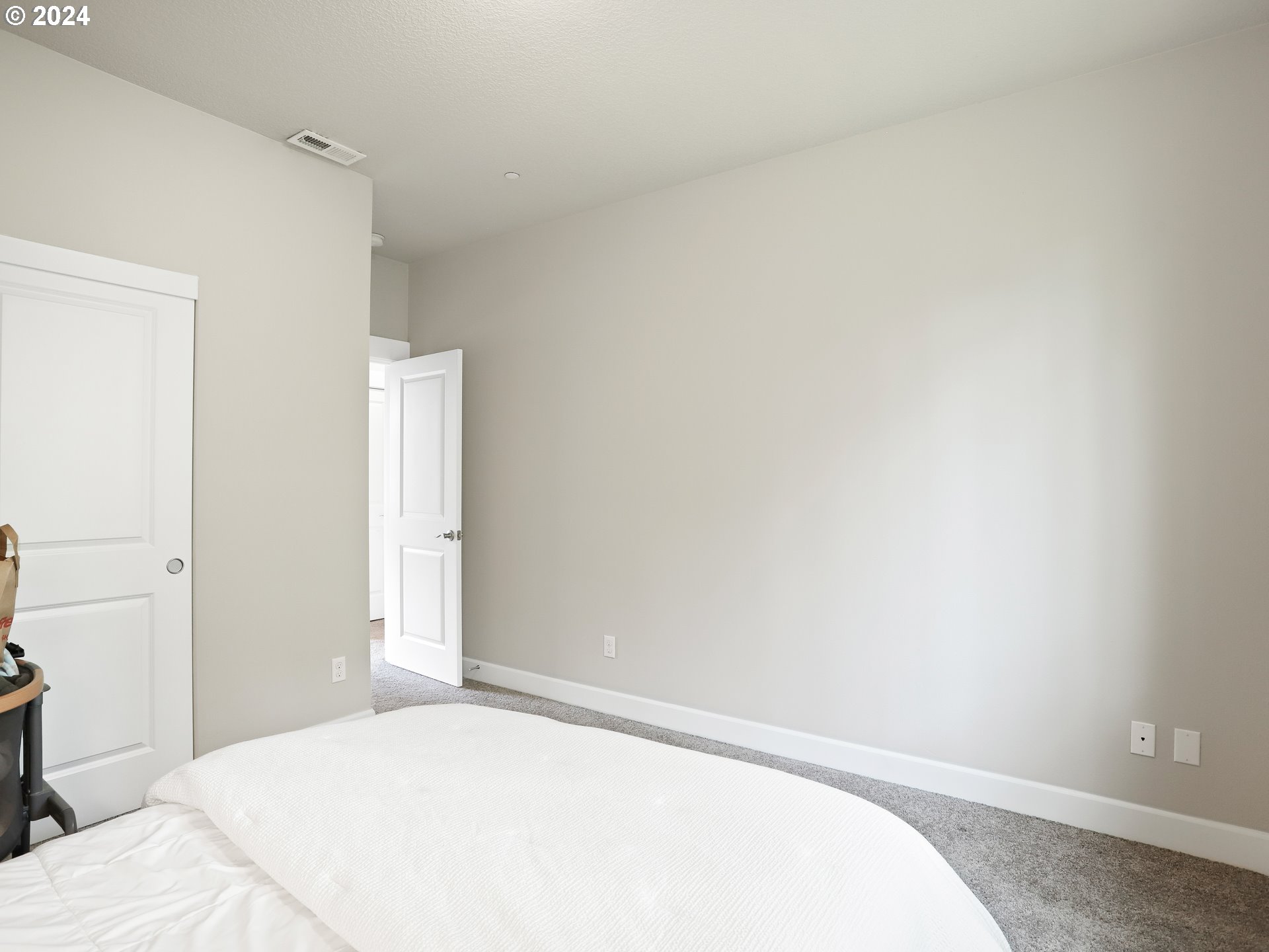 8087 Southwest Oldham Drive Beaverton, OR 97007 - Photo 35 of 46 a bedroom with a bed