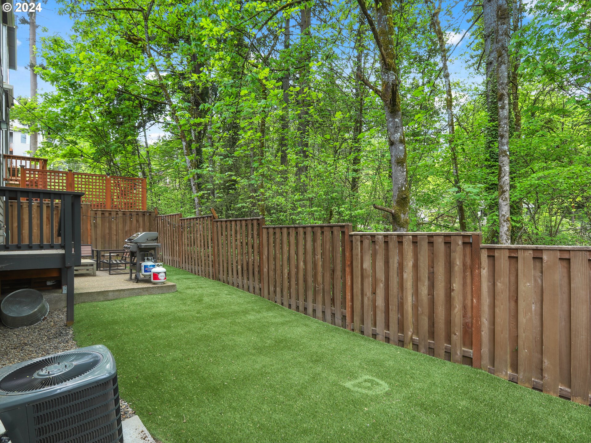 8087 Southwest Oldham Drive Beaverton, OR 97007 - Photo 40 of 46 a view of backyard with wooden fence and a trampoline