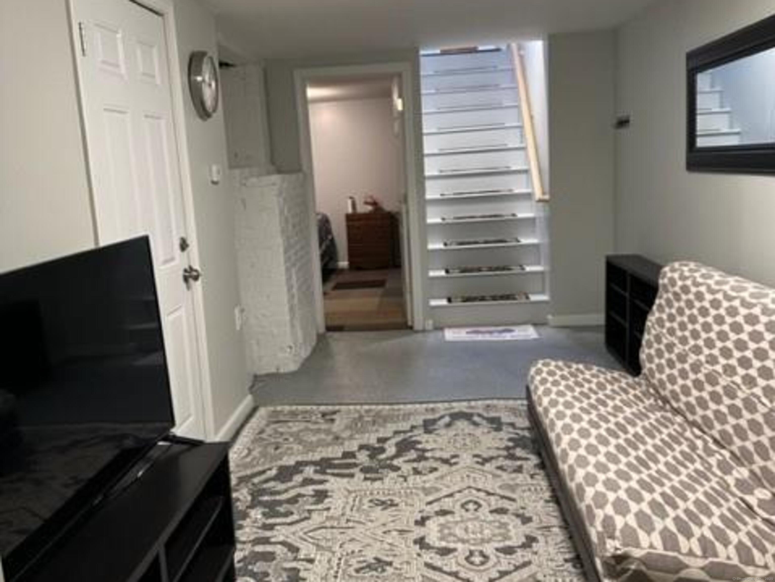 94 William Street New Haven, CT 06511 - Photo 2 of 8 a living room with furniture and a flat screen tv