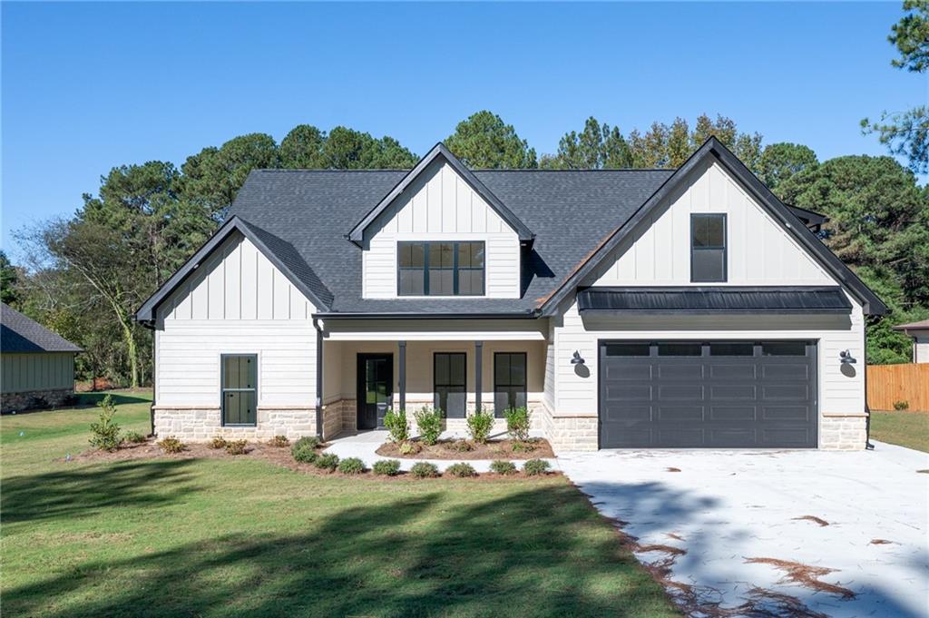 140 Cambridge Court Calhoun, GA 30701 - Photo 1 of 29 a front view of a house with a garden and yard