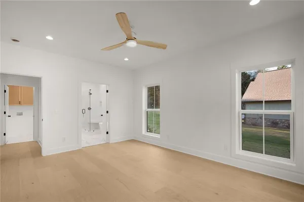 a spacious bathroom with double sink and shower