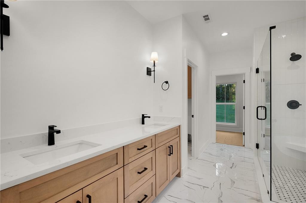 140 Cambridge Court Calhoun, GA 30701 - Photo 19 of 29 a spacious bathroom with double sink and shower