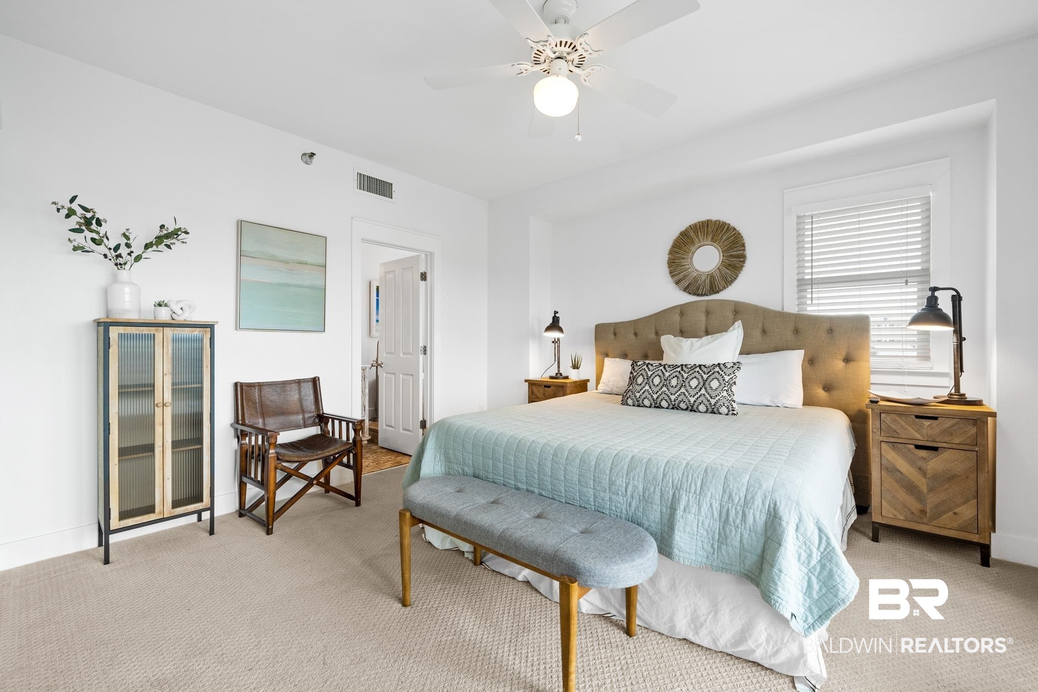 815 Plantation Road, Unit 301 Gulf Shores, AL 36542 - Photo 12 of 29 Bedroom featuring baseboards, ceiling fan, visible vents, and light colored carpet