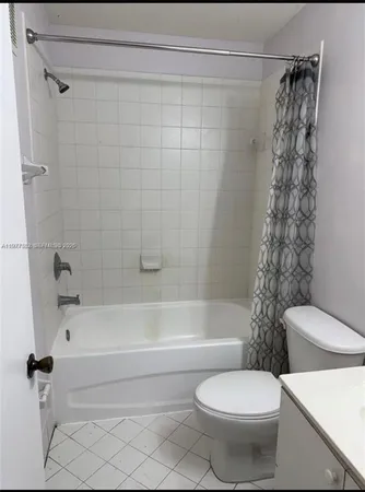 a bathroom with a toilet and a bathtub