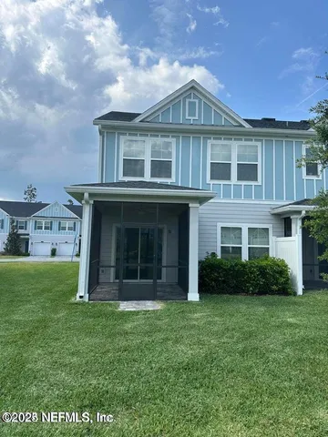 a view of a big house with garden