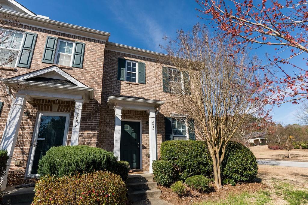 2037 Bayrose Circle Atlanta, GA 30344 - Photo 1 of 1 a front view of a house with garden