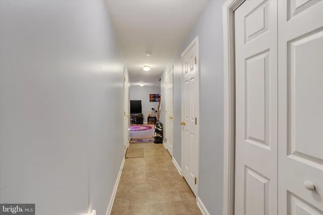a view of a hallway with a chair