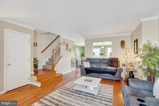 a living room with furniture and a rug