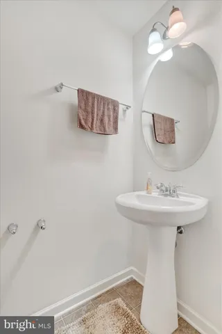 a bathroom with a sink a mirror and vanity