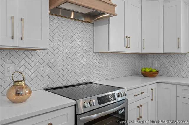 a bathroom with a granite countertop sink a mirror and vanity