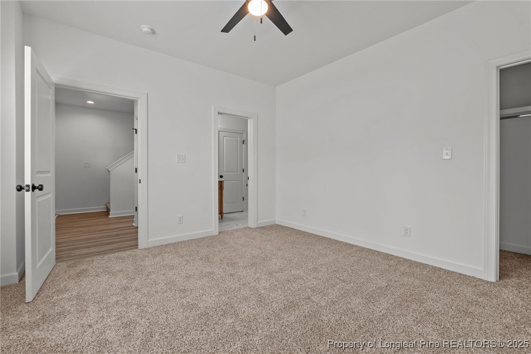 58 Magnolia Grv Way Cameron, NC 28326 - Photo 17 of 25 an empty room with chandelier fan