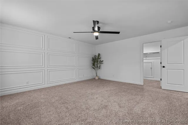 a bathroom with double vanity sinks and a mirror
