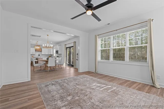 a view of a dining room with furniture window and wooden floor