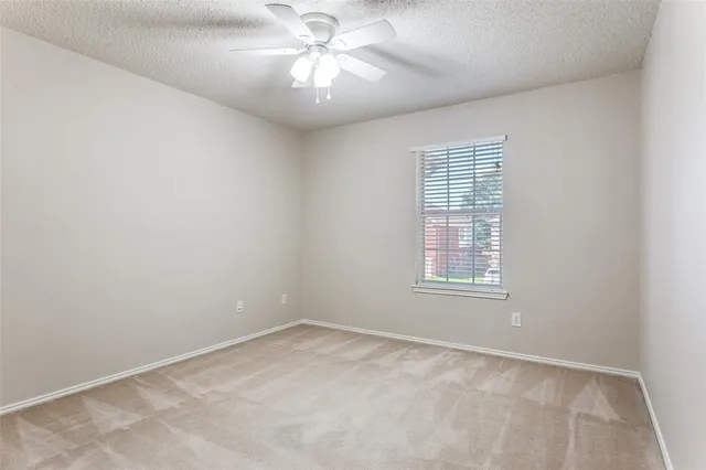 a front view of a house with a yard table and chairs