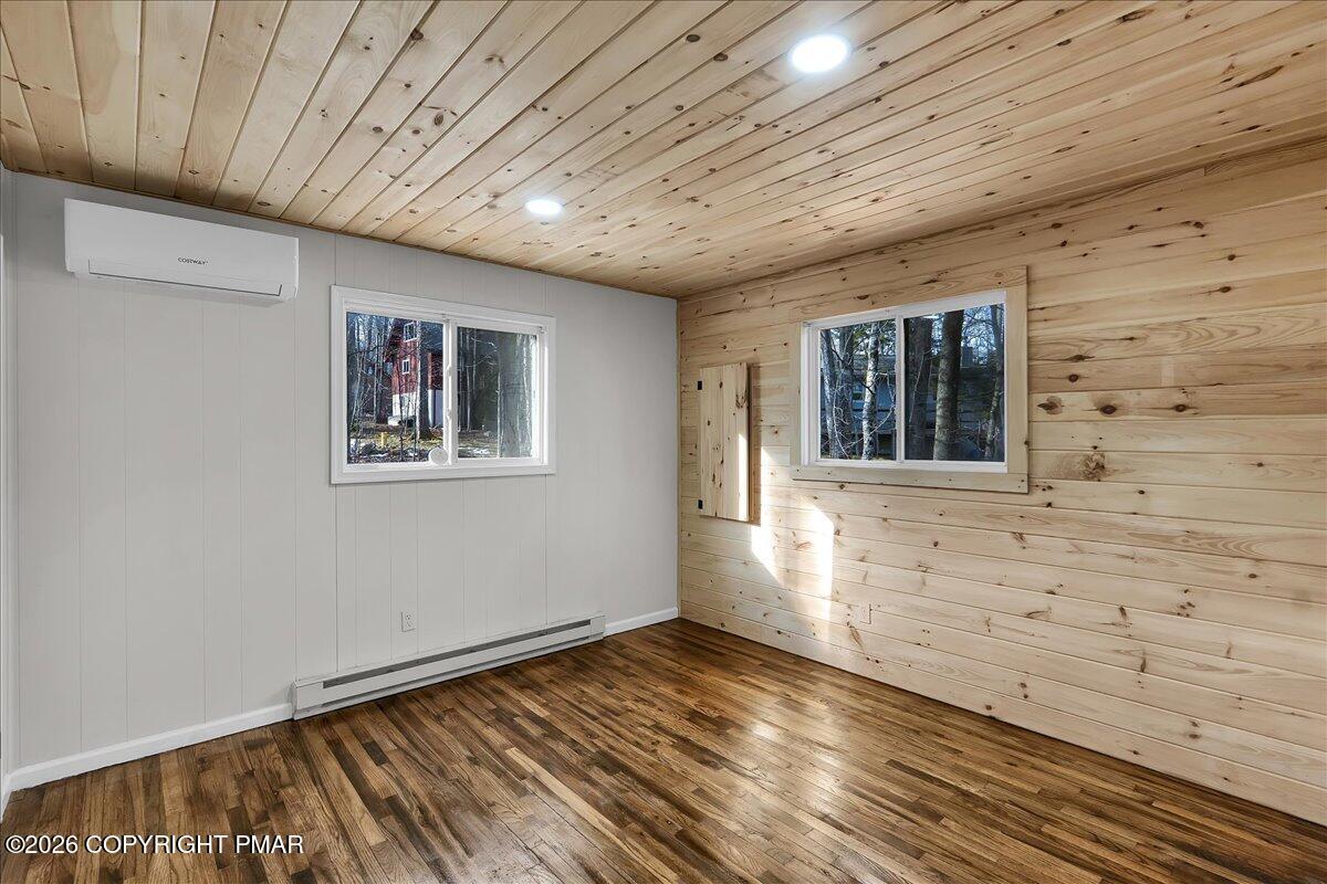 309 Selig Road Pocono Lake, PA 18347 - Photo 13 of 25 a view of empty room with wooden floor