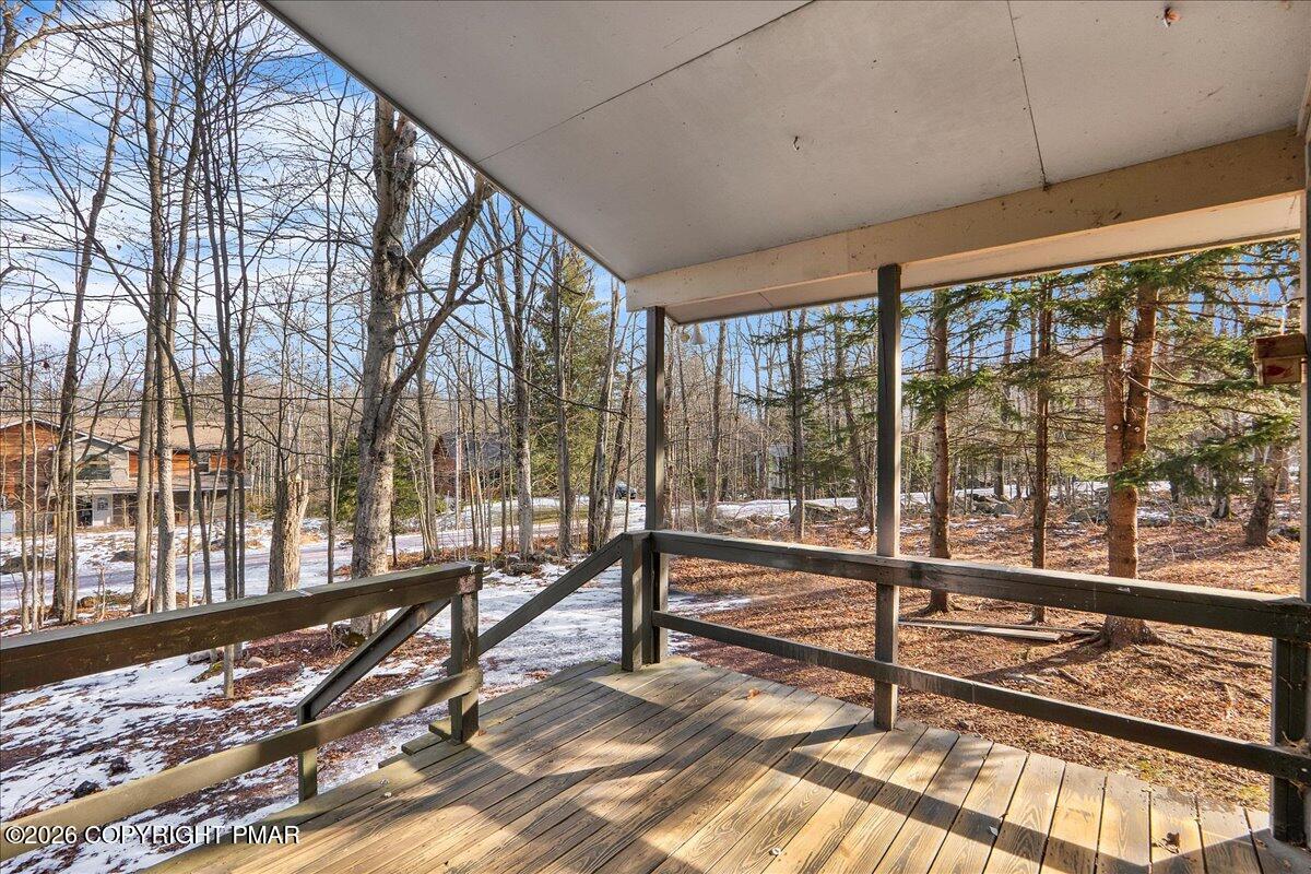309 Selig Road Pocono Lake, PA 18347 - Photo 20 of 25 a view of a living room and floor to ceiling window or wooden floor