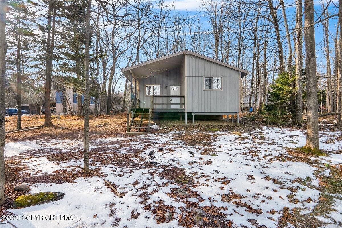 309 Selig Road Pocono Lake, PA 18347 - Photo 23 of 25 a house with trees in the background