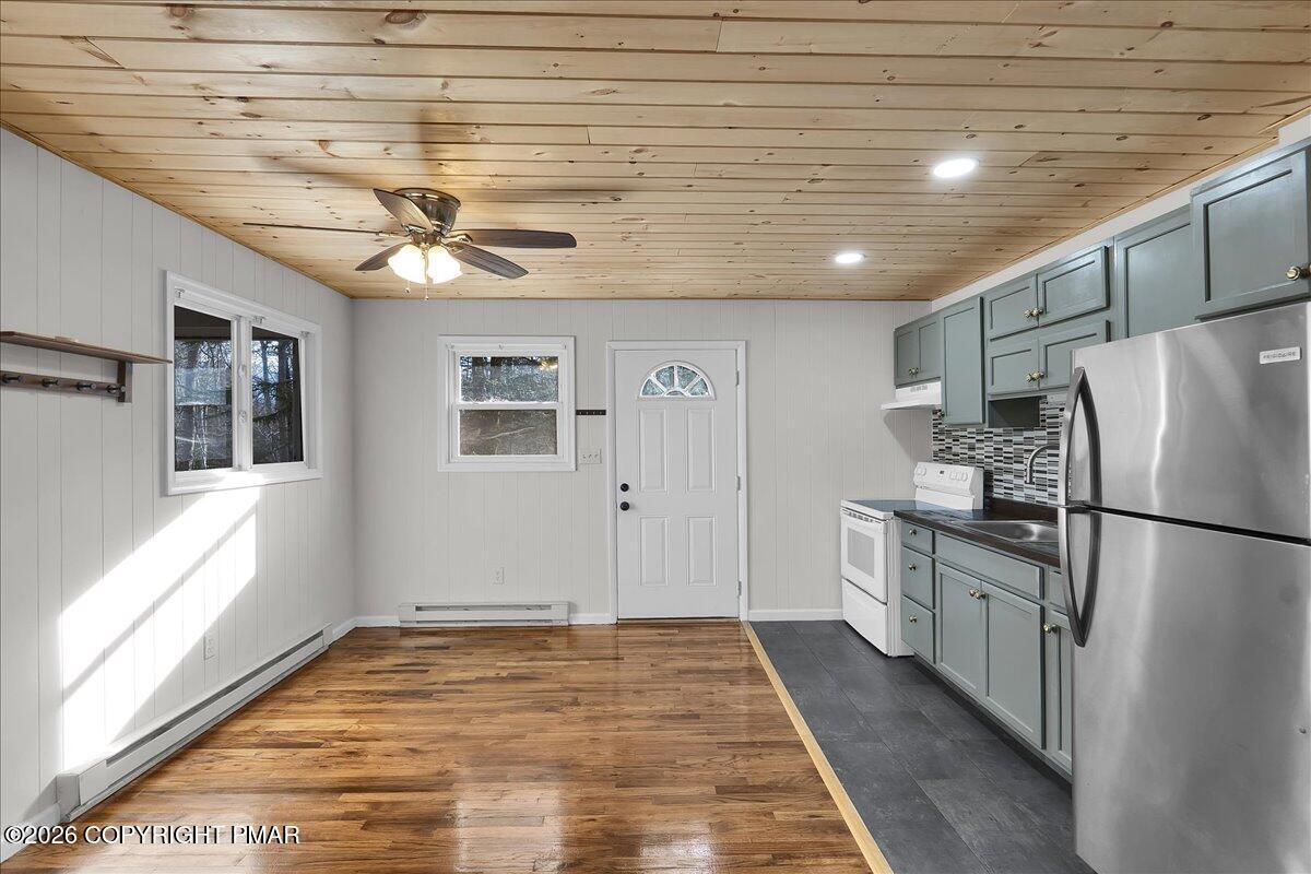 309 Selig Road Pocono Lake, PA 18347 - Photo 3 of 25 a kitchen with a refrigerator and a window