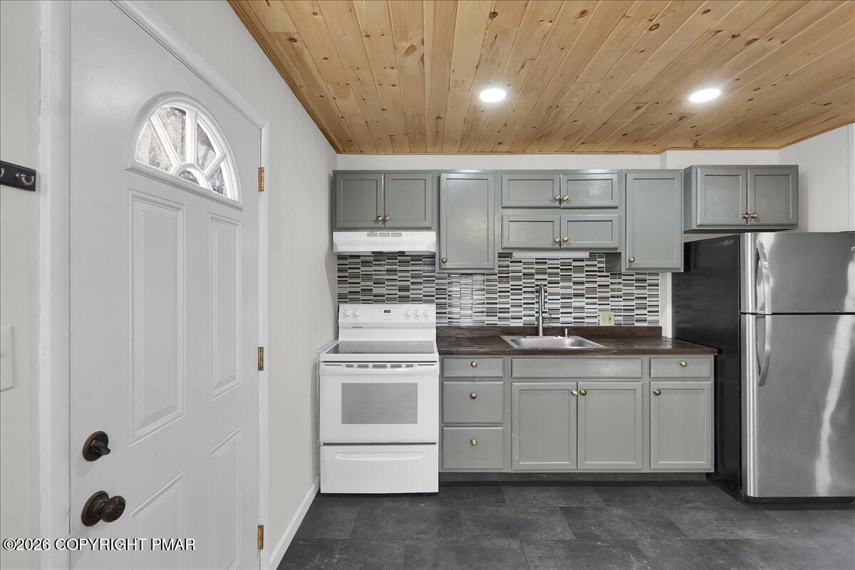 309 Selig Road Pocono Lake, PA 18347 - Photo 5 of 25 a kitchen with stainless steel appliances a refrigerator and a sink