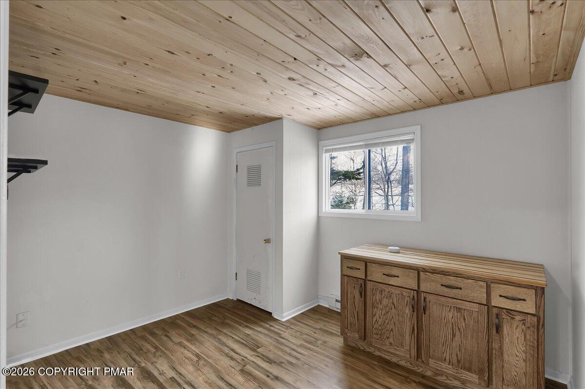 309 Selig Road Pocono Lake, PA 18347 - Photo 10 of 25 a view of empty room with window and wooden floor