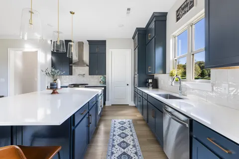 a spacious bedroom with a large bed and a window