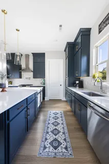 a white bath tub sitting in a bathroom next to a window