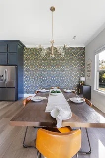 a view of a livingroom with furniture and a window