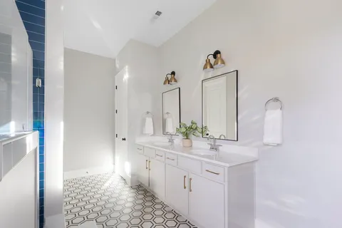 a living room filled with furniture hardwood floor and a swimming pool