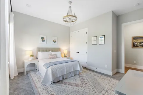 a view of a lake with houses in the background