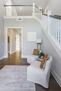 a large kitchen with stainless steel appliances kitchen island granite countertop a sink and cabinets