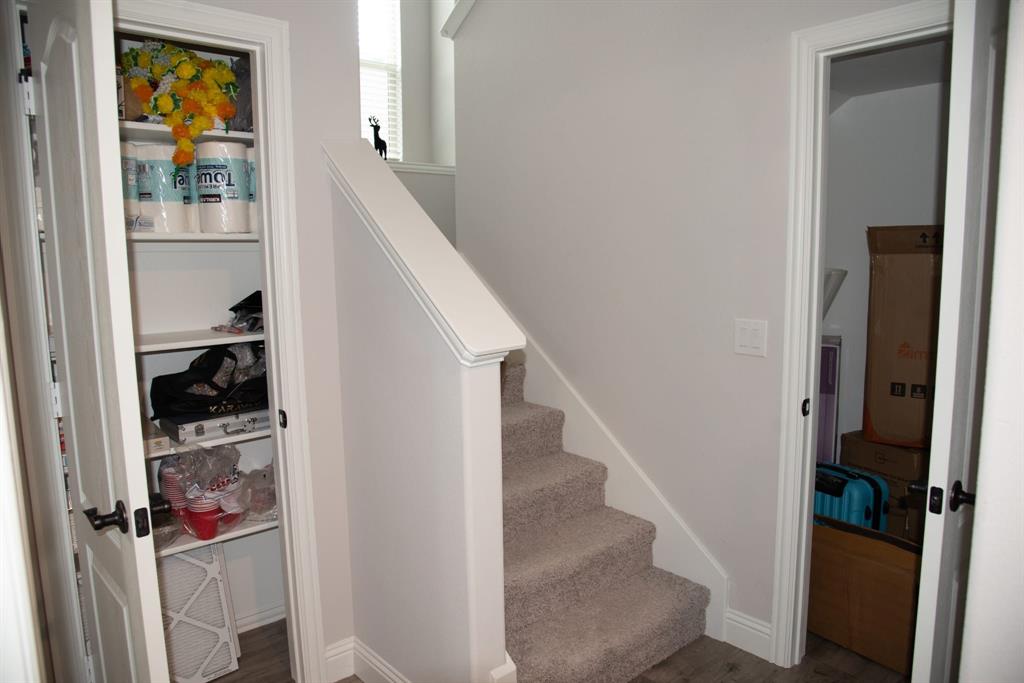 809 Woodview Court Anna, TX 75409 - Photo 19 of 25 a view of a hallway with wooden floor and entryway