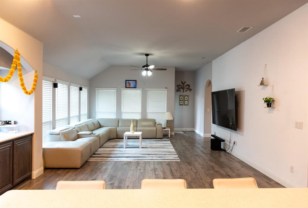 809 Woodview Court Anna, TX 75409 - Photo 4 of 25 a living room with furniture and a flat screen tv