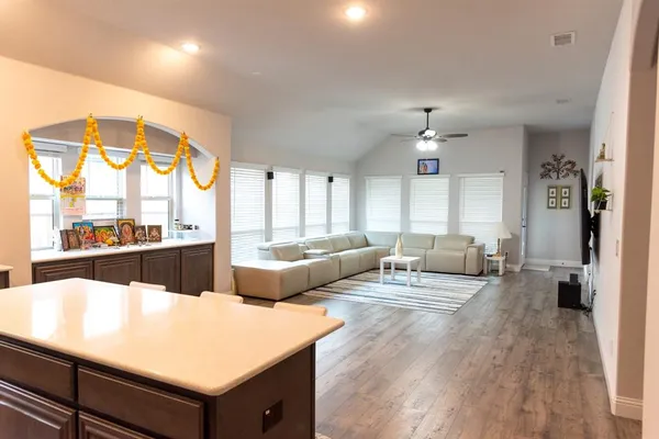 a living room with furniture and a large window