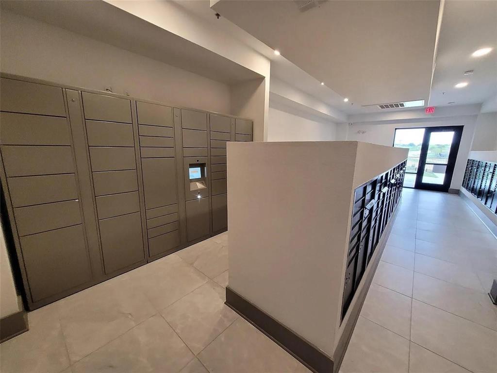 2700 Old Denton Road, Unit 2238 Carrollton, TX 75007 - Photo 9 of 21 Dedicated parcel lockers and individual mailboxes within a brightly lit communal area
