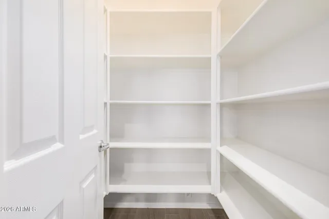 a view of an empty walk in closet