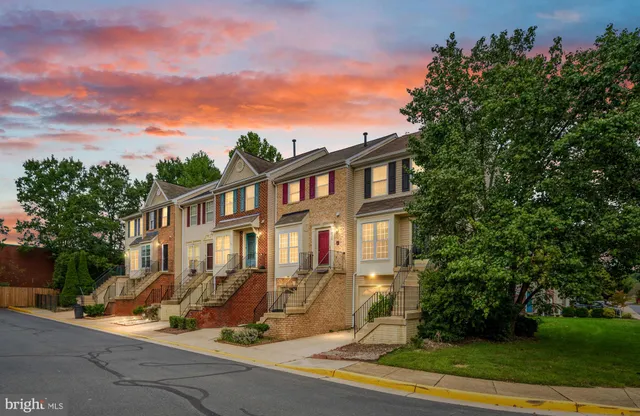 front view of a house with a tree