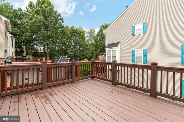 a view of deck with wooden floor and fence