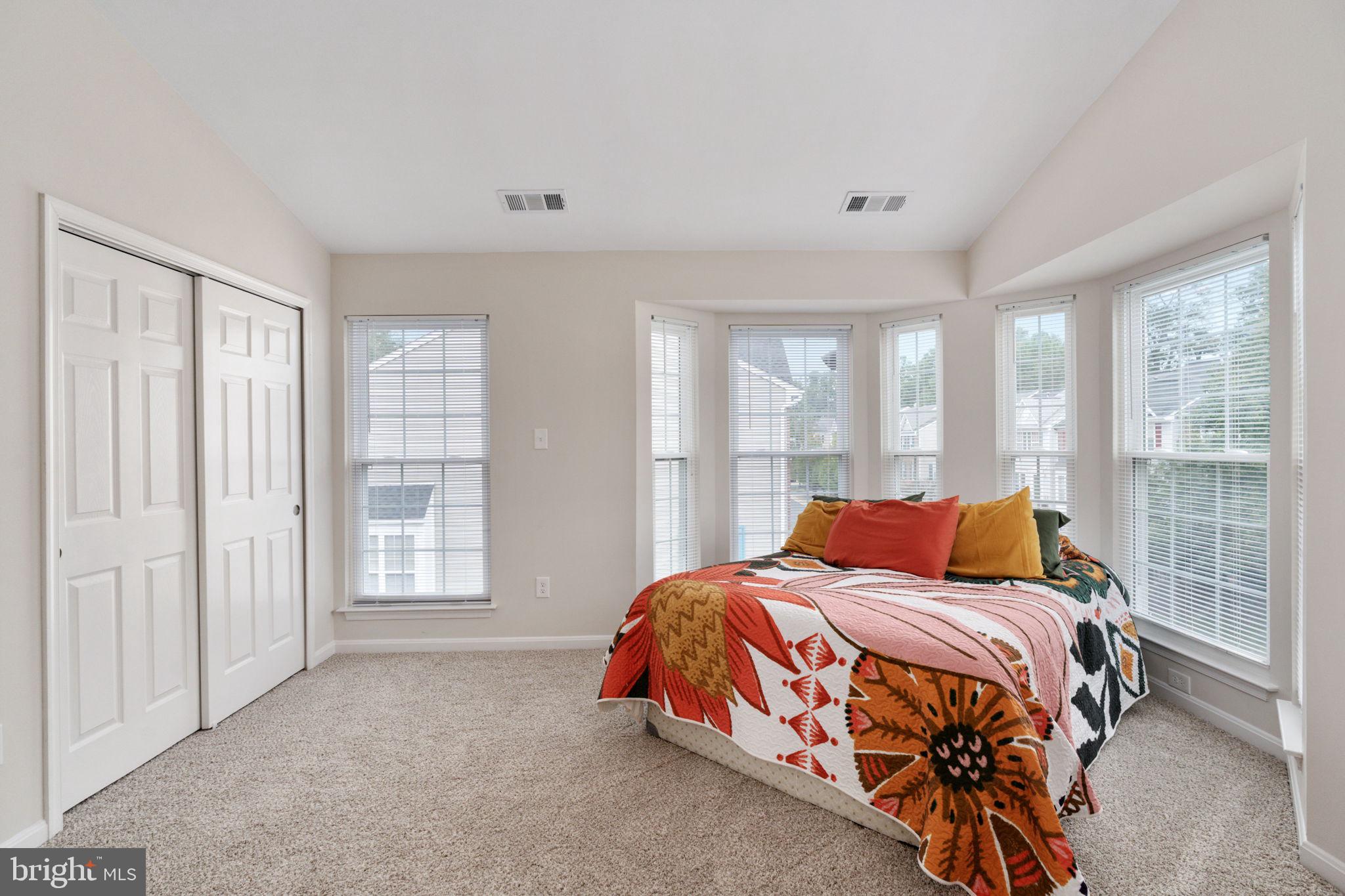 8548 Towne Manor Court Alexandria, VA 22309 - Photo 33 of 53 a bedroom with a bed and large window