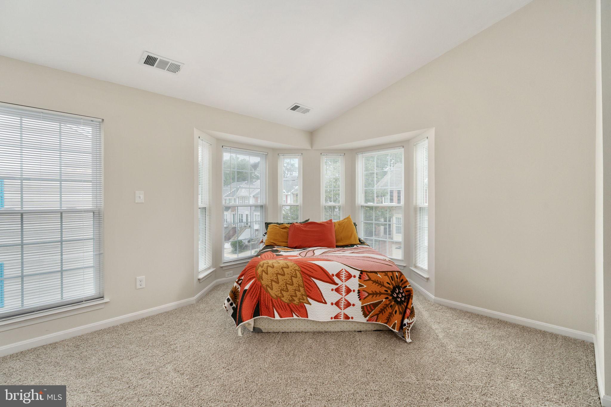 8548 Towne Manor Court Alexandria, VA 22309 - Photo 36 of 53 a bedroom with a bed and window