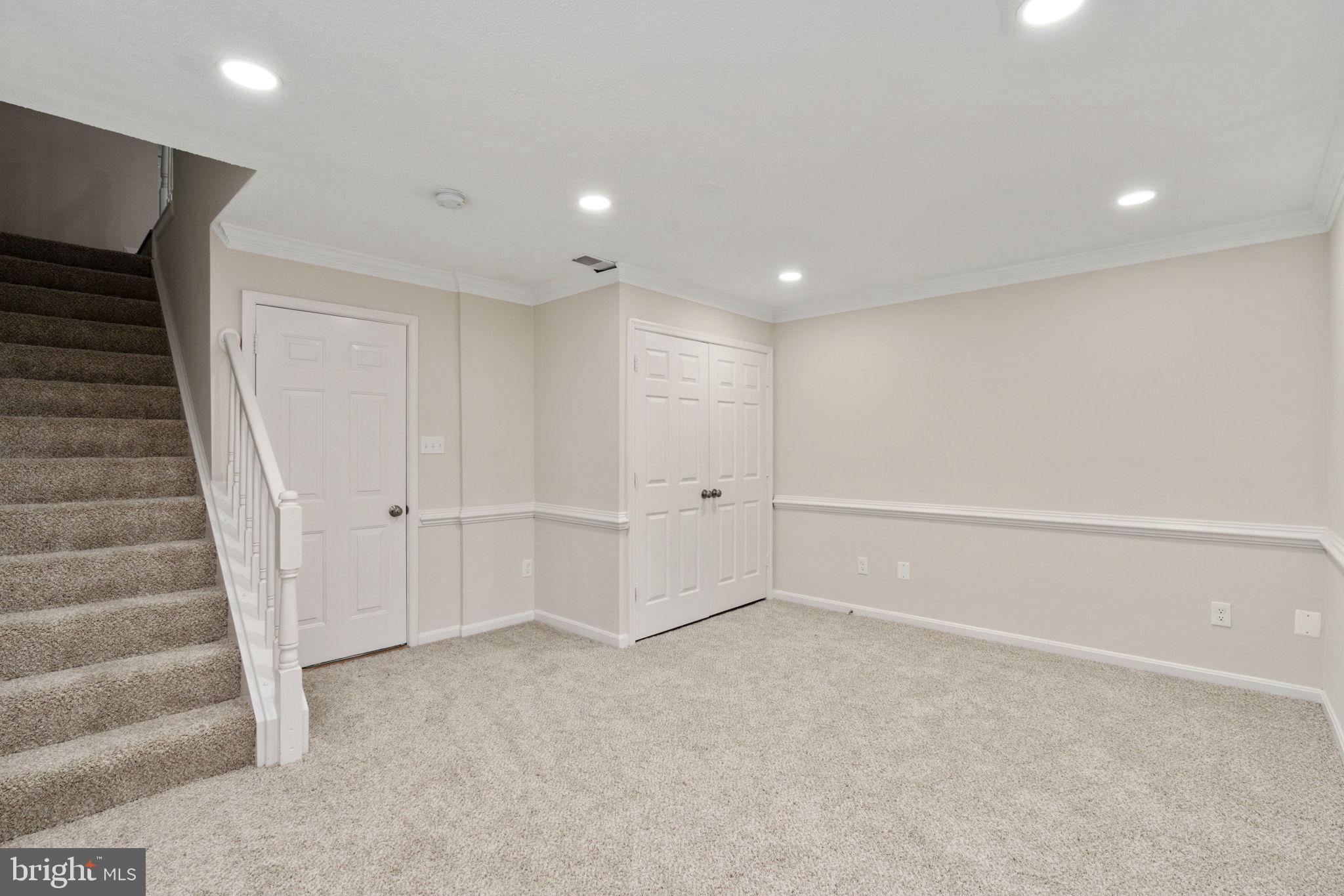 8548 Towne Manor Court Alexandria, VA 22309 - Photo 39 of 53 a view of an empty room with stairs