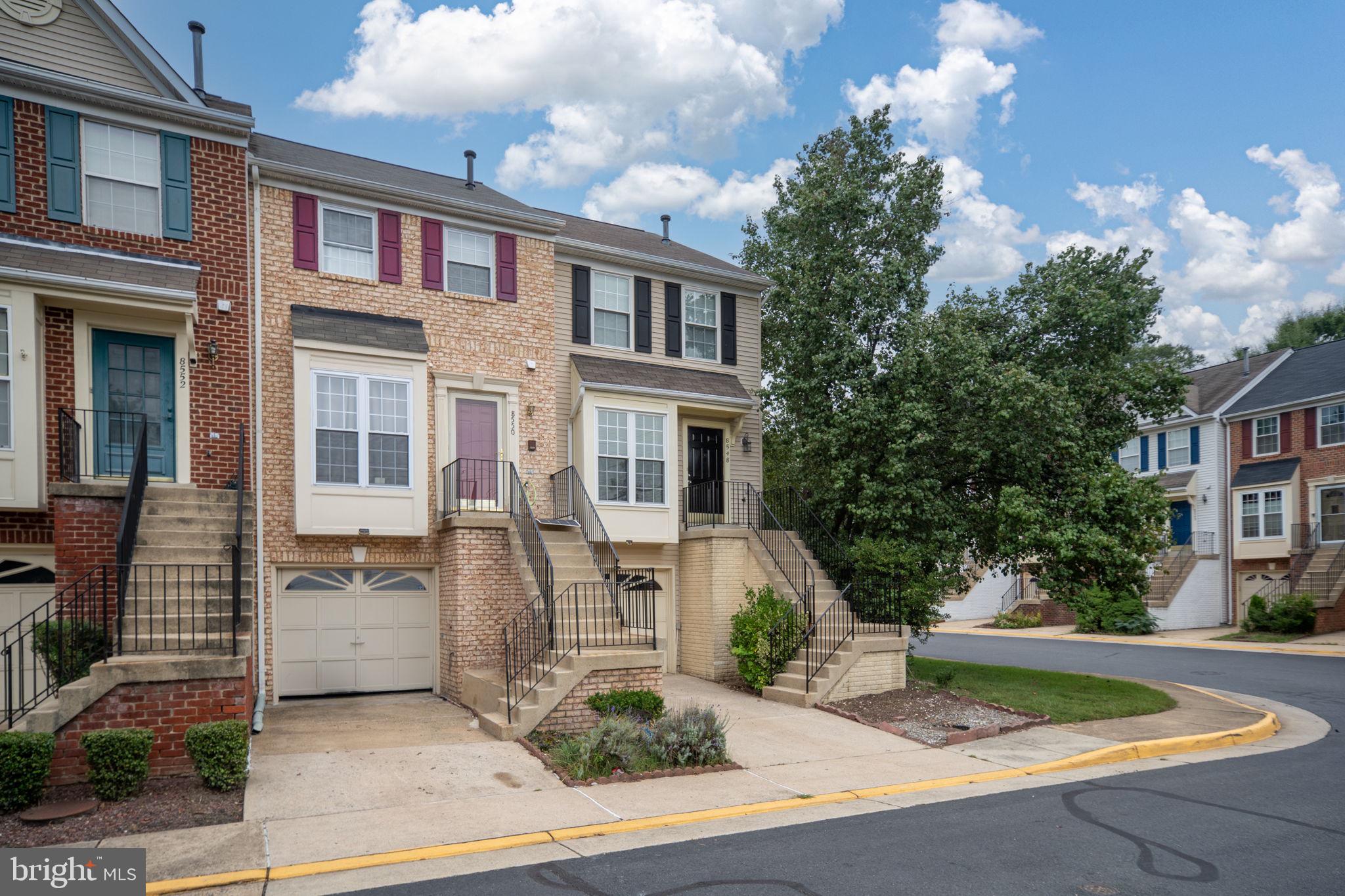 8548 Towne Manor Court Alexandria, VA 22309 - Photo 4 of 53 a front view of a house with garden