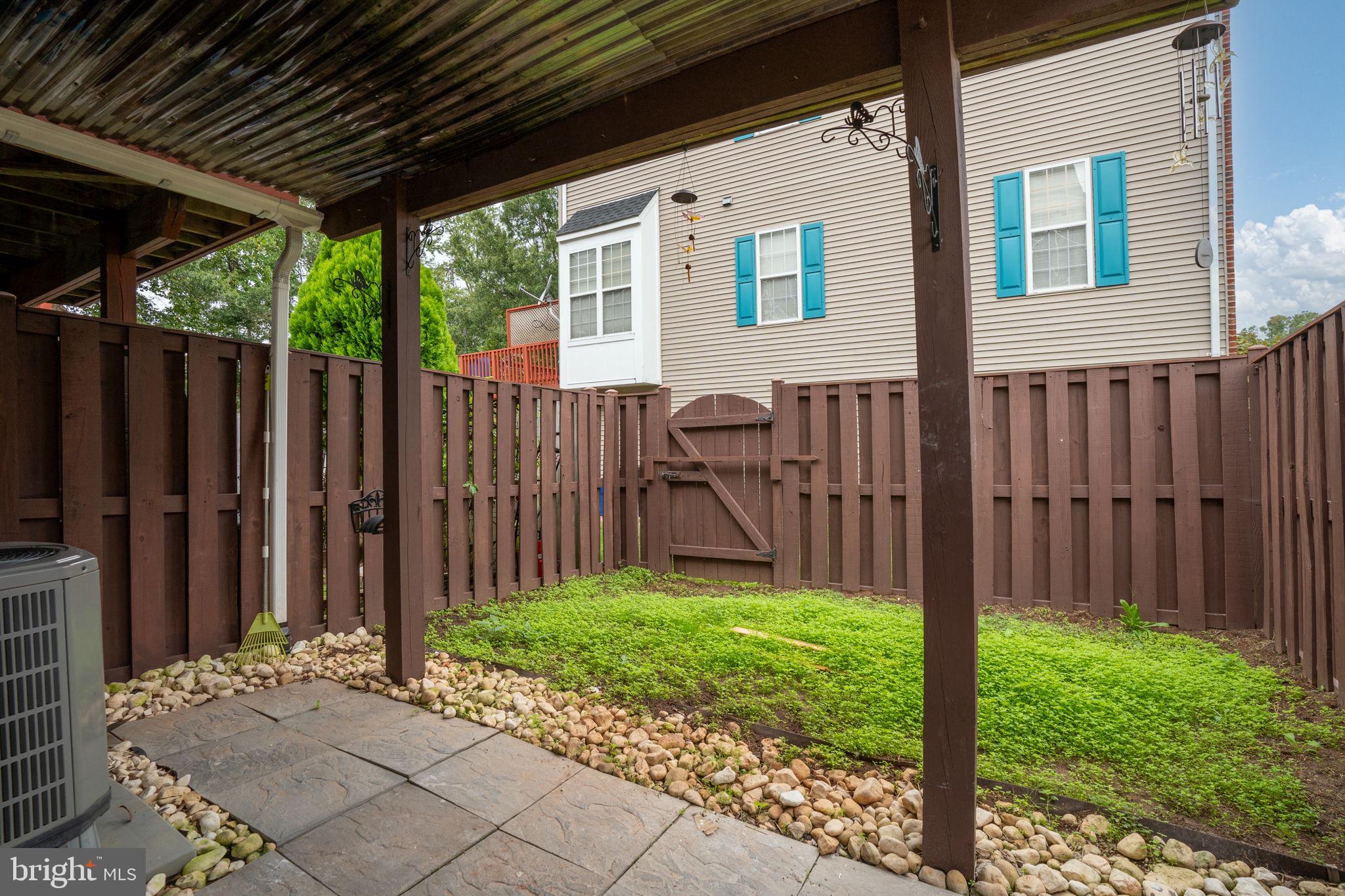 8548 Towne Manor Court Alexandria, VA 22309 - Photo 48 of 53 a view of a house with backyard and wooden fence