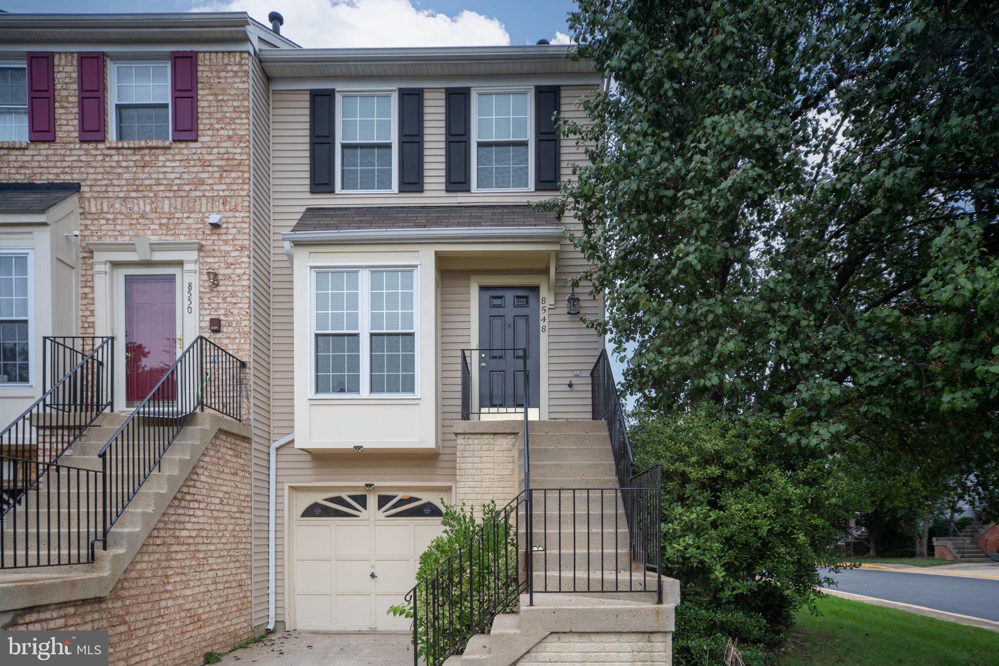 8548 Towne Manor Court Alexandria, VA 22309 - Photo 7 of 53 a front view of a house with a garden