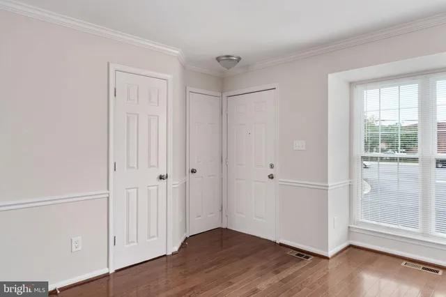 a view of entryway with wooden floor