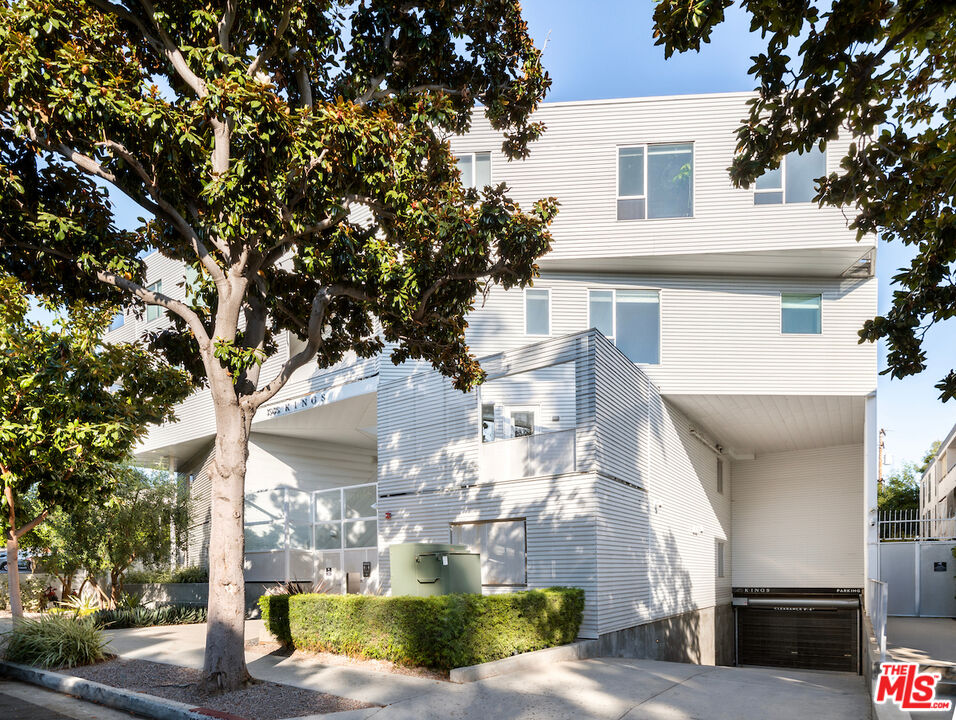 1030 North Kings Road, Unit 407 West Hollywood, CA 90069 - Photo 1 of 19 a view of a white house next to a tree