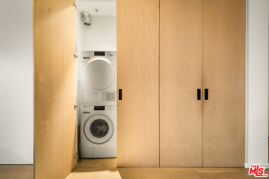 1030 North Kings Road, Unit 407 West Hollywood, CA 90069 - Photo 13 of 19 a bathroom with a sink and mirror
