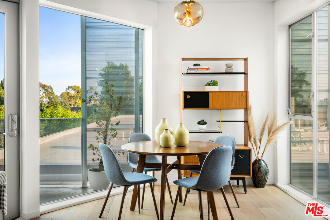 1030 North Kings Road, Unit 407 West Hollywood, CA 90069 - Photo 3 of 19 a dining room with furniture and window