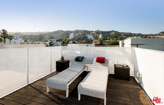 a view of a terrace with lounge chair