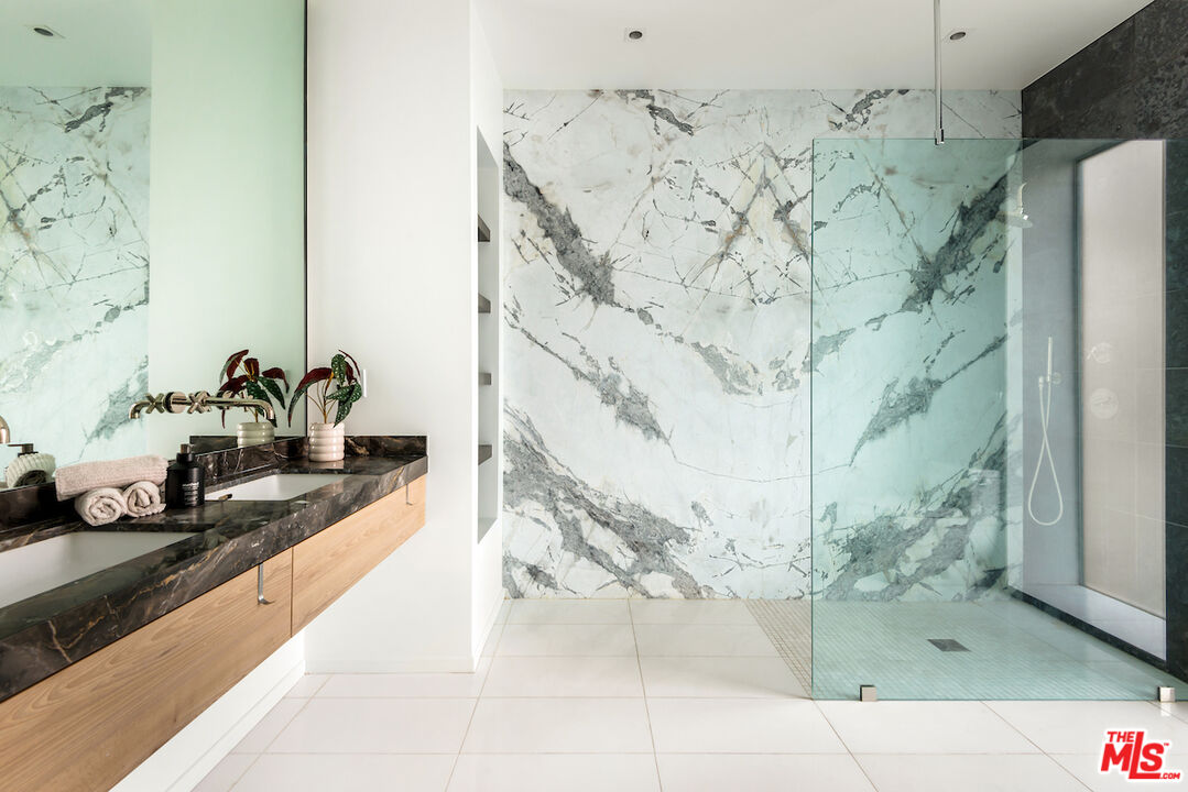 1030 North Kings Road, Unit 407 West Hollywood, CA 90069 - Photo 10 of 19 a bathroom with a shower and a sink